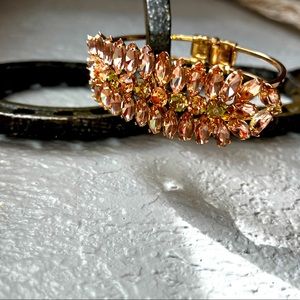 Rose gold clasp bangle with pink and green stones